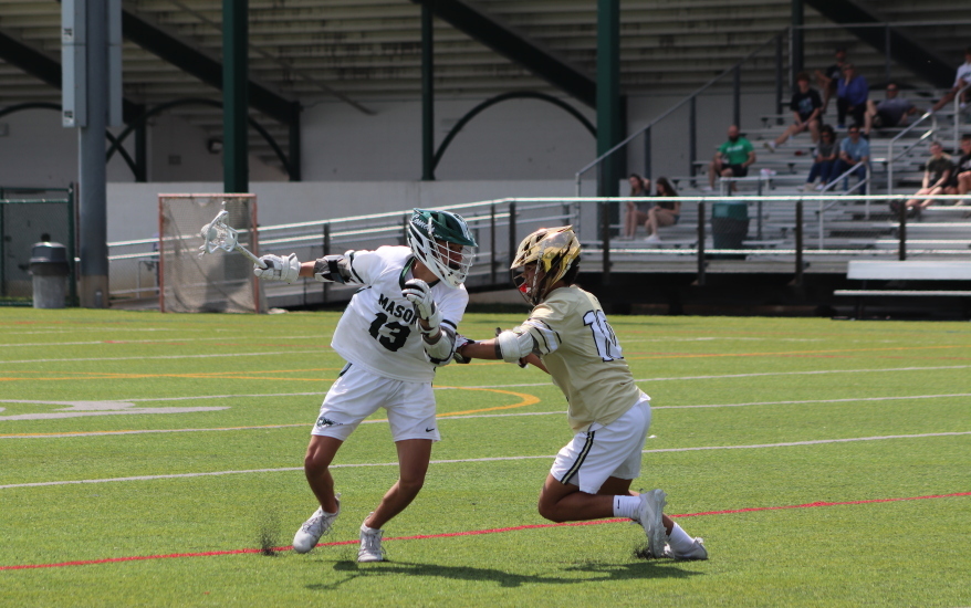 two boys defending on field